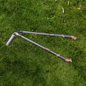 surecut adjustable hedge shears laying on lawn